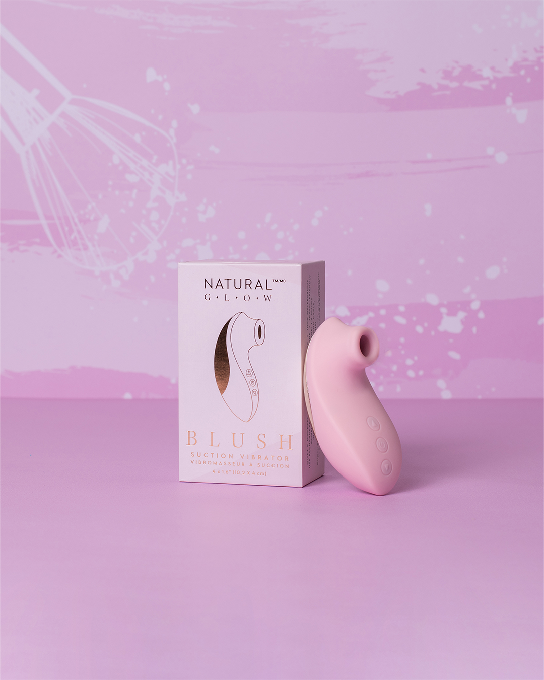 ויברטור יניקה ורוד על רקע אולפן עם אקססוריז טיפוח