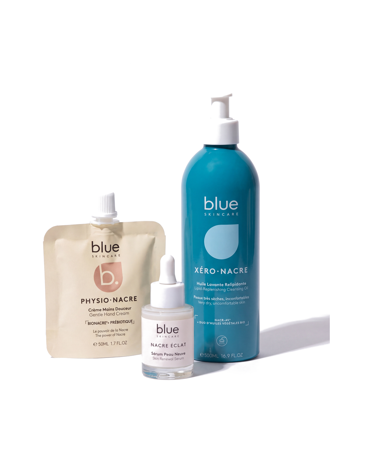 Clear Skin Ritual by Blue Skincare - XERO-NACRE lipid-replenishing cleansing oil 500ml, NACRE ECLAT skin renewal serum 30ml and PHYSIO-NACRE gentle hand cream 50ml on white
