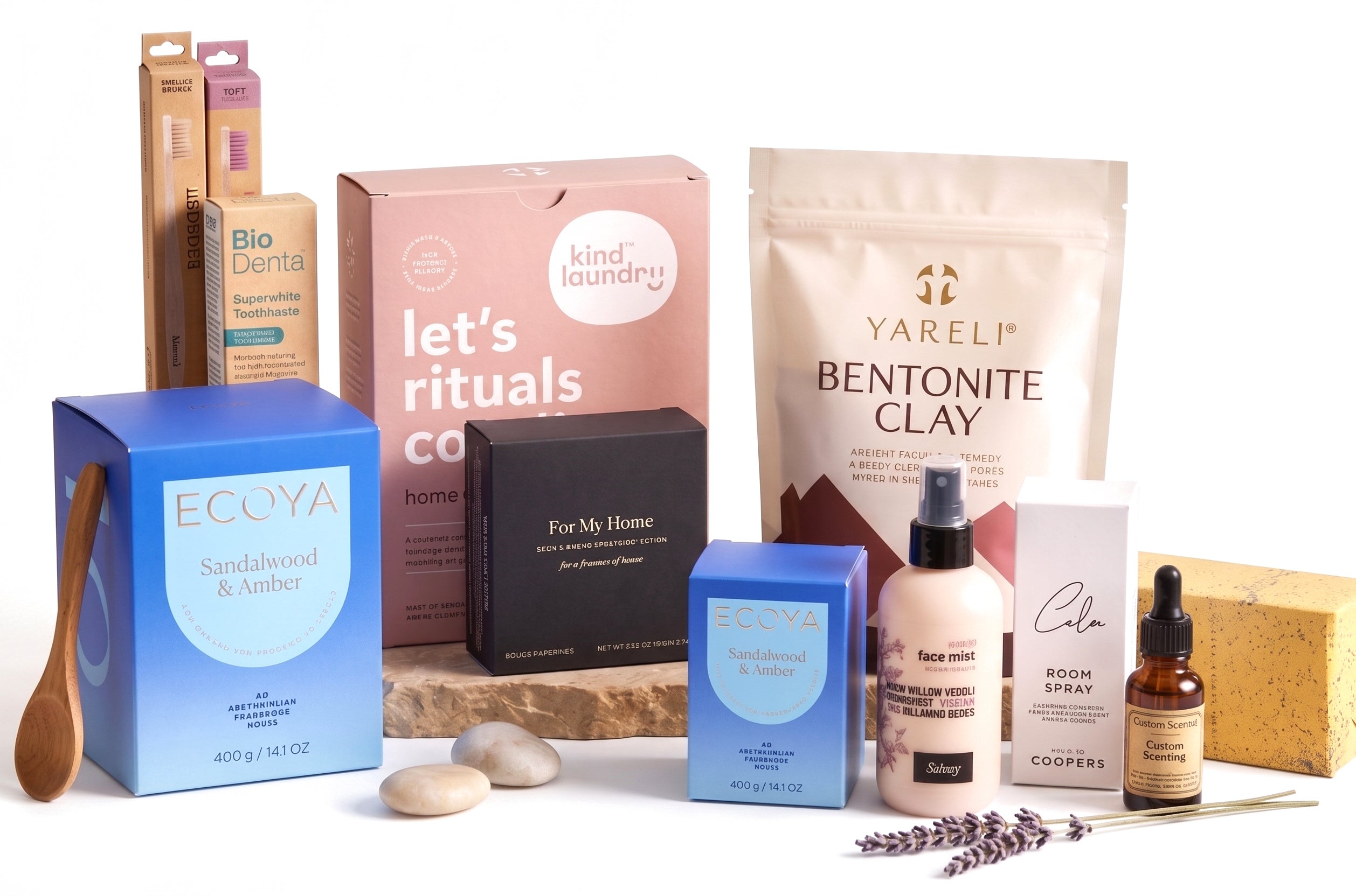The Holiday Premium Ritual — product line-up with sandalwood candles and clay mask on pure white