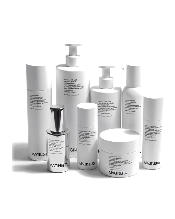 Maginista Ultimate Haute Couture Ritual - all eight MAGINISTA hair products on white: Daily-Reset shampoo, Therapist conditioner, Plasticity hair mask, 230 Celcius leave-in, Body Bardot thickening lotion, Fumo mousse, Activist salt spray, Psychographic hairspray